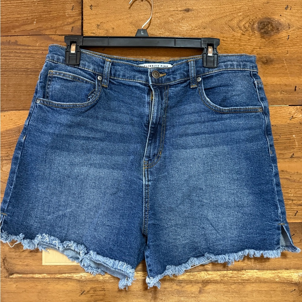 Celebrity Pink Denim Cutoff Shorts in Medium/Dark Blue. Like new, size 15/32